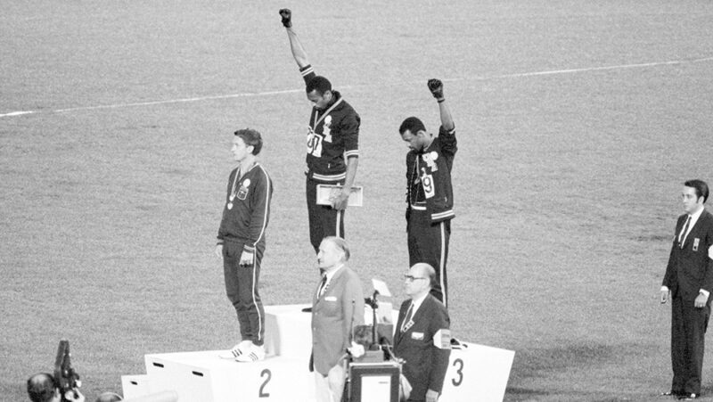 USA gold and bronze medallists Tommie Smith and John Carlos raise their fists at the 1968 Olympics in one of the most famous sports protests of all time.