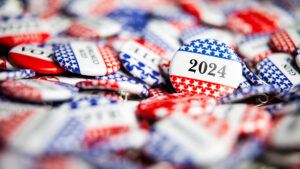 Closeup of buttons with stars and stripes and text that says 2024