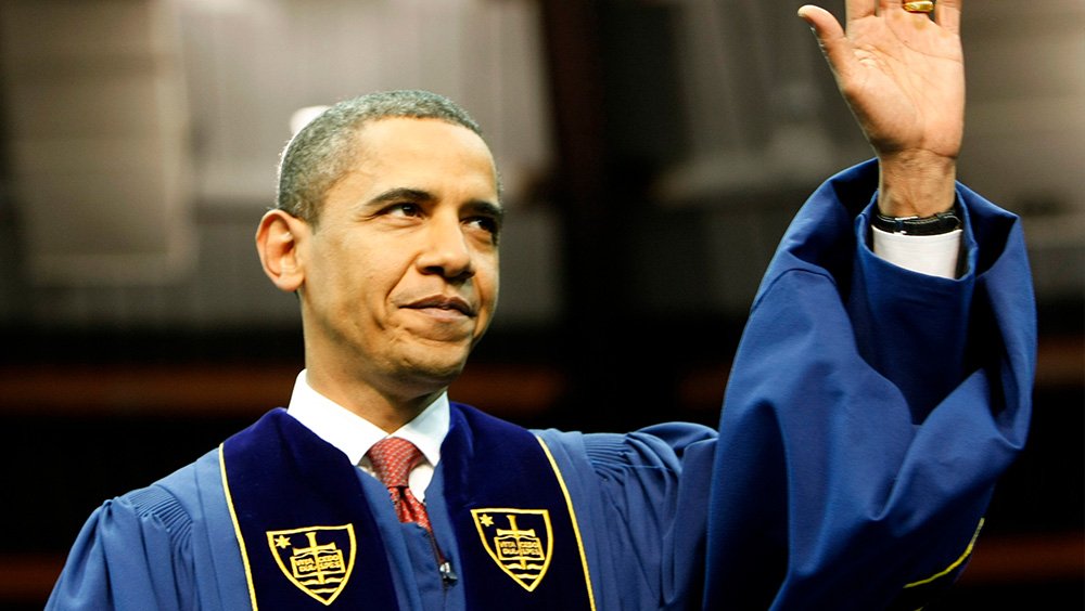 President Barack Obama waves as he arrives to deliver the commencement speech during the 2009 graduation ceremony at the University of Notre Dame.