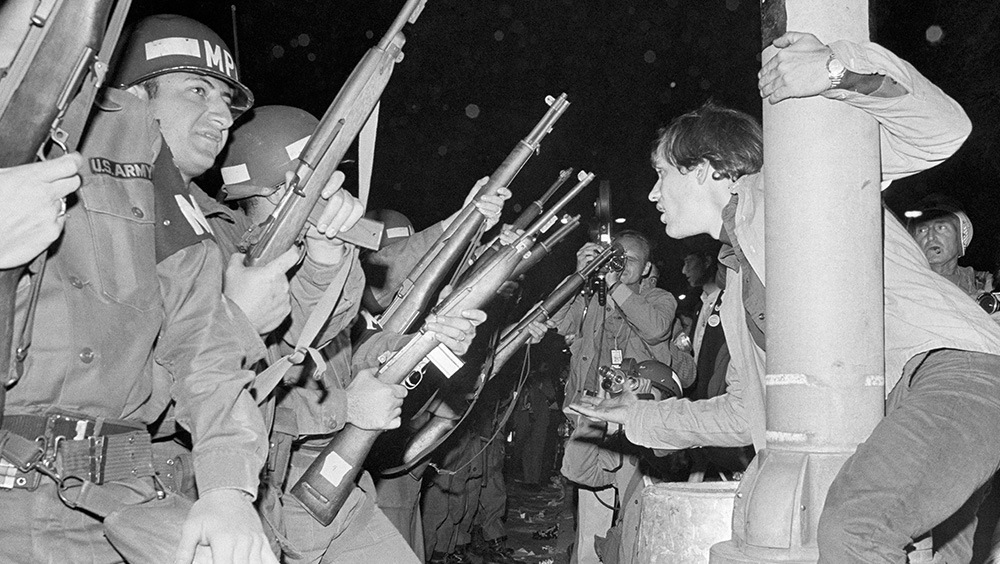 Chicago police officers attempt to disperse demonstrators outside the Conrad Hilton, the 1968 Democratic National Convention headquarters hotel.