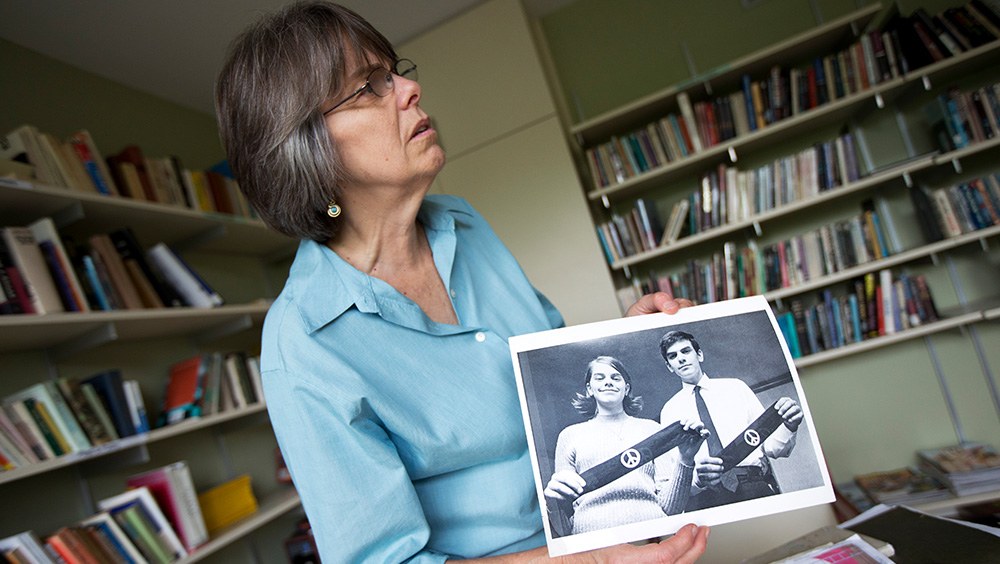 Mary Beth Tinker showing an old photo of her with her brother John Tinker and their Vietnam War protest armbands.