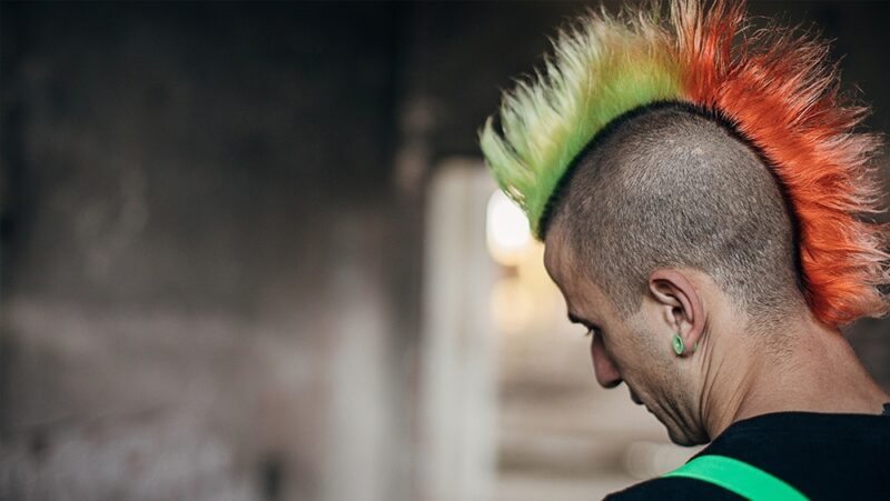 Rear view of man with colorful spiky mohawk hairstyle