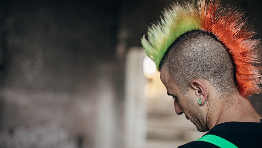 Rear view of man with colorful spiky mohawk hairstyle