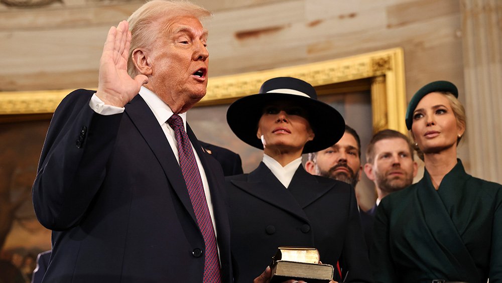 Donald Trump takes the oath of office as his wife Melania and his children look on during inauguration ceremonies in the Rotunda of the U.S. Capitol on January 20, 2025 in Washington, DC.